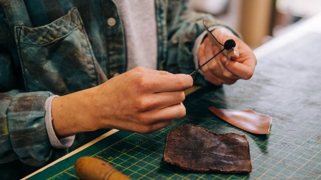 Tignanello brand heritage Italian leather craftsmanship artisan handmade handbag production quality materials